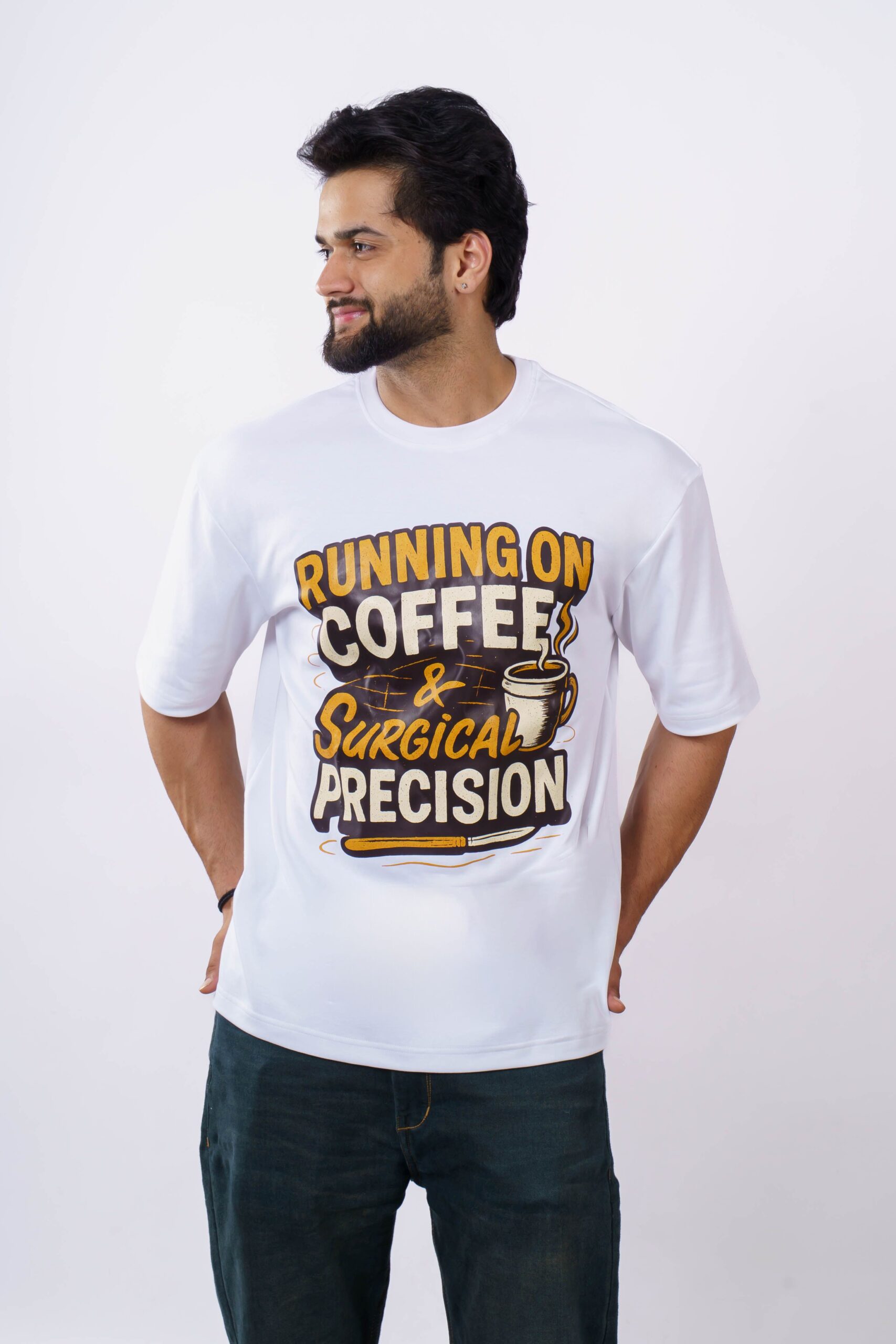Man wearing a white t-shirt with a humorous coffee and precision quote on it.